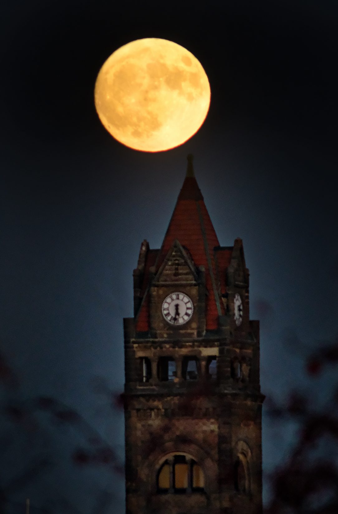 City hall tower under full moon